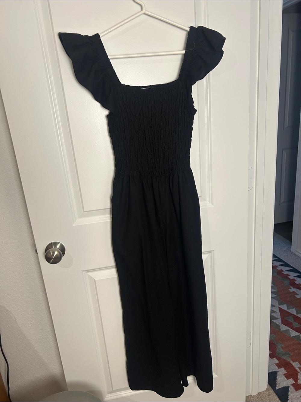 Mud Pie Black Smocked Jumpsuit with Flutter Sleeves